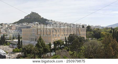 Hellenic Parliament Government Building In Athens Greece And Mount Lycabettus