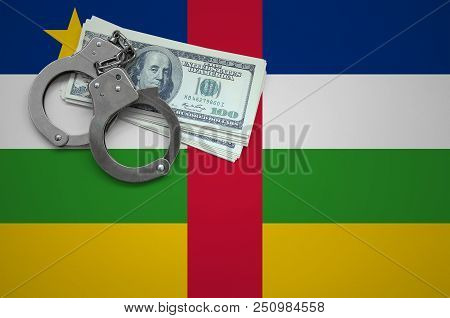 Central African Republic Flag  With Handcuffs And A Bundle Of Dollars. The Concept Of Breaking The L