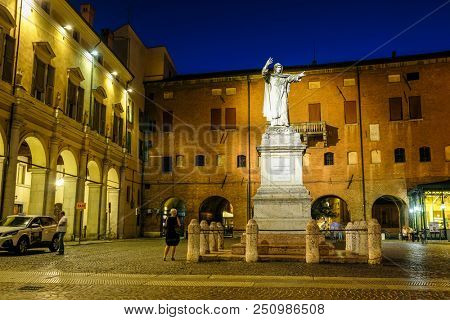 Ferrara, Italy - July, 23, 2018: monument of Savonarola in the historical center of Ferrara at a night
