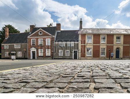 Beccles, Suffolk, Uk, July 2018 - View Of A Cobbled Road And Historic Houses In Old Market, Beccles,