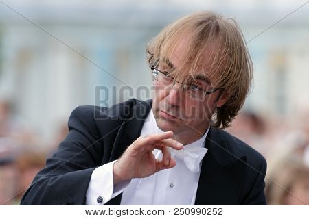 ST. PETERSBURG, RUSSIA - JULY 22, 2018: Conductor Fabio Mastrangelo during the open air performance of the opera  on the closing of the festival All Together Opera at the Catherine Palace