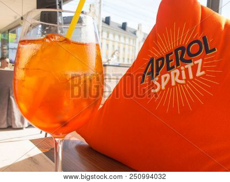 Moscow, Russia - July 18, 2018: Full glass of Aperol Spritz cocktail on the table in the restaurant. This drink is very poular this summer season