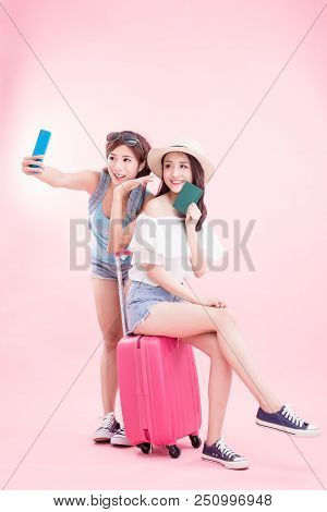Two Beauty Women Selfie Happily With Travel Concept On The Pink Background