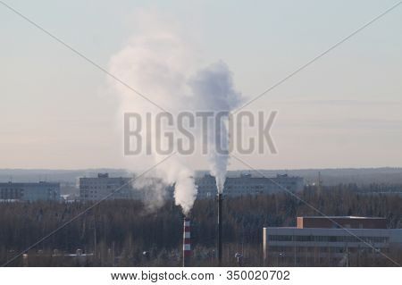 Cloud Of Smoke Rising Up From Indastrial Chimney On Background Of Cloudy Sky. Indastrial Zone In Cit
