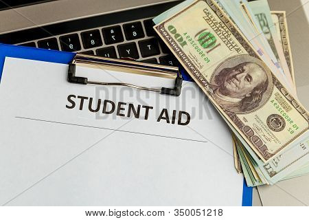 Fafsa. Student Aid Concept. Application Form Of Document On The Table With Money.