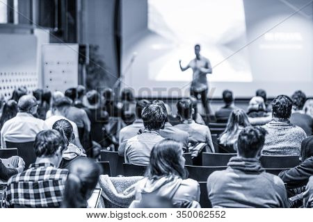 Male Public Peaker Giving Presentation On Business Conference Event.