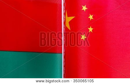Fragments Of National Flags Of The Republic Of Belarus And China In Close-up
