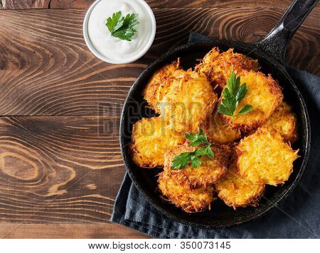 Potatoes Pancakes Latkes, Flapjacks, Hash Brown Or Potato Vada With White Greek Yoghurt Or Sour Crea