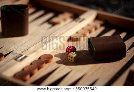 A Game Of Backgammon Played In The Sun