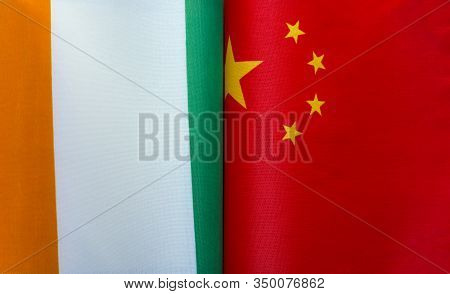 Fragments Of The National Flags Of Ireland And China In Close-up