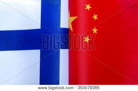 Fragments Of National Flags Of The Republic Of Finland And China In Close-up