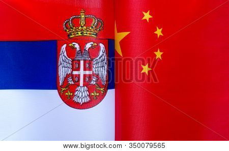 Fragments Of National Flags Of The Republic Of Serbia And China Close-up