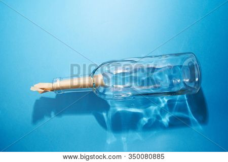 blank massage in a botol on the blue background