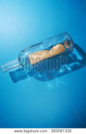 blank massage in a botol on the blue background