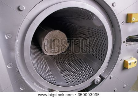 Men Workers Get Carpet From An Automatic Washing Machine And Put In In Dryer In The Laundry Service