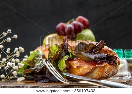 A Delicious Smoked Salmon Sesame Bread Sandwich On A Wooden Plate. It Is Perfect Eaten With Salads A