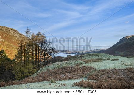 Epic Autumn Fall Landscape Of Ullswater And Surrounding Mountains And Hills Viewed From Hallin Fell 