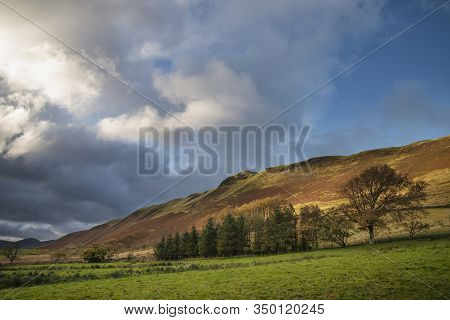 Stunning Autumn Fall Landscape View Along Valley Towards Mellbreak And Grasmoor In Lake District Wit