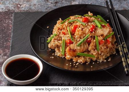 Tori Chahan Fried Japanese Rice With Vegetables And Chicken In Soy Sauce In A Black Plate On A Servi