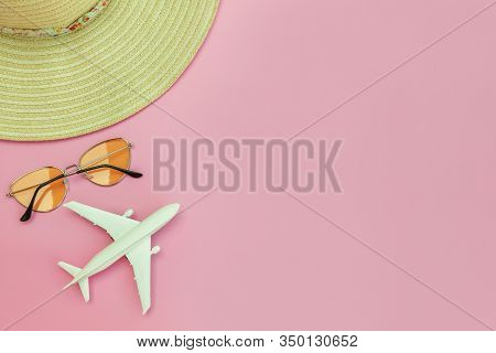 Summer Beach Composition. Minimal Simple Flat Lay With Plane Sunglasses And Hat Isolated On Pastel P