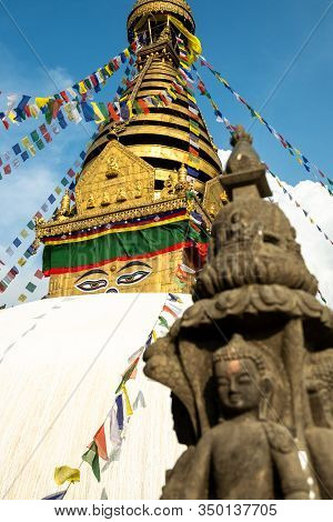 The Upper Part Of The Stupa In Buddhist Temple Swayambhunath In Kathmandu Against The Background Of 