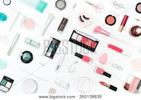 Feminine Makeup Aqua Mente And Pink Palette Accessories With Nail Polish Manicure Tools On White Bac