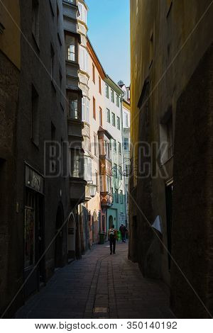 Insbruk, Austria - February 2020:pedestrians, Residents And Tourists In The Narrow Streets Of The Ol
