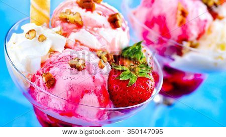 Yummy Tasty Fresh Strawberry Ice Cream In Glass Pot.