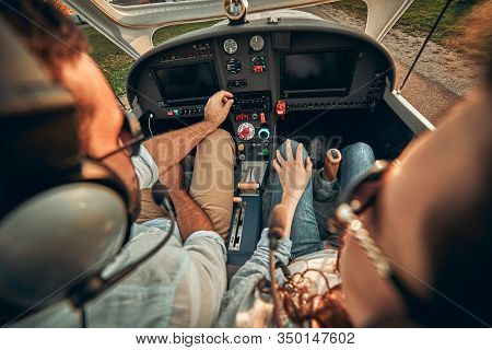 Rear View Of Pilot And Copilot Operating Controls Of Private Plane