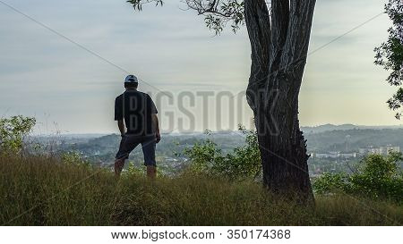 A Hiking Man Is Standing On The Top Of Hill And Looking To The Landscape Of Lubuk Temiang Village La