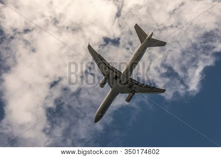 Nawiliwili, Kauai, Hawaii, Usa. - January 17, 2020: Closeup Of Gray Underbelly Of Flying Airplane La
