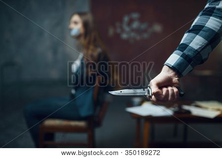 Maniac kidnapper with knife, scared female victim