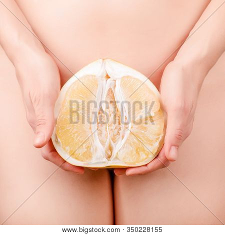 Half Of Pomelo Citrus In Woman Hand. Clitoral Or Vaginal Orgasm. Vagina Symbol. Sex, Woman Intimate 