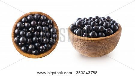 Black Berries On White. Blackcurrants In A Wooden Bowl Isolated On White Background. Blackcurrant Is