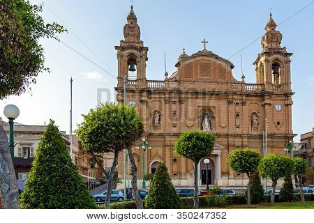 Beautiful View Of The Catholic Baroque Church On The Background Of Blue Sky. Amazing Cityscape With 
