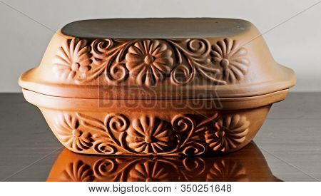 Ceramic Pot Used In Kitchens For Cooking. The Food Cooked In This Pot Is Much Tastier. Floral Motifs