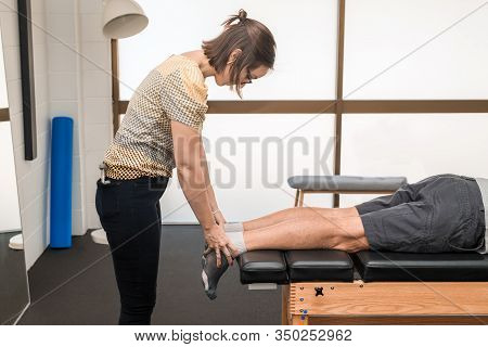 Man Having Chiropractic Back Adjustment. Physioterapy, Osteopathy, Alternative Medicine Pain Relief 