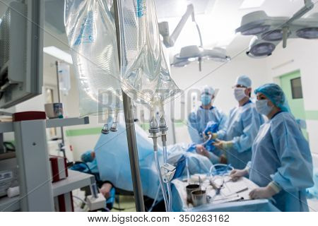 Arthroscope Surgery. Orthopedic Surgeons In Teamwork In The Operating Room