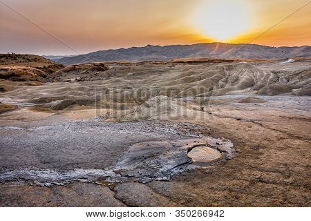 Beautiful Lunar Landscape With A Sunset Over The Muddy Volcanoes, Paclele, Berca, Buzau County, Roma