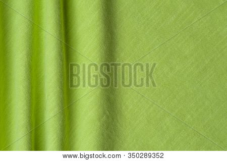 Close-up Fragment Of A Beautiful Yellow Cotton Fabric. Concept Of High-quality Raw Materials For Tai