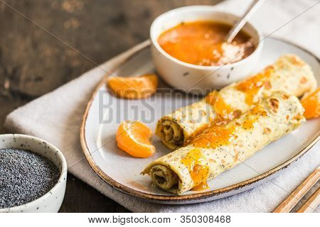 Poppy Seed Crepes (blinis). Pancakes With Poppy Seeds And Tangerine Jam