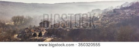 Early Morning Mist Rolling Down From The Hills On To The Rural Landscape Of Veliko Tarnovo, In Bulga