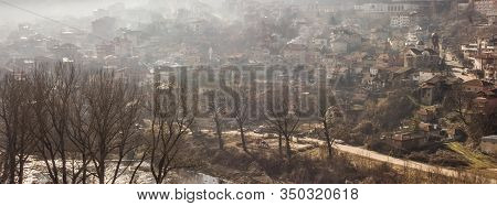 Early Morning Mist Rolling Down From The Hills On To The Rural Landscape Of Veliko Tarnovo, In Bulga