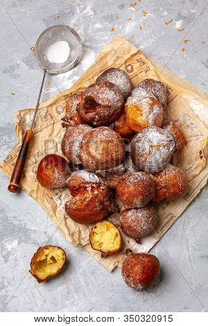 Traditional French Doughnuts Beignet With Orange Zest And Powdered Sugar. Top View.