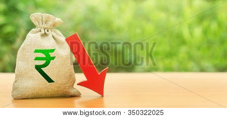 Indian Rupee Money Bag And Red Arrow Down. Economic Decline Difficulties. Deposit Interest Rate Redu