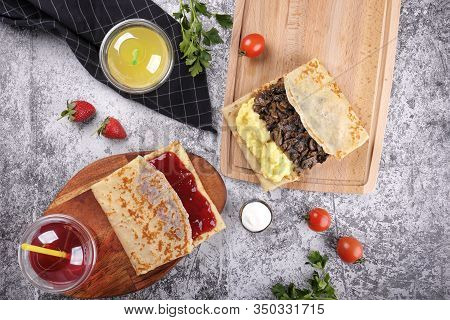 Shrovetide Maslenitsa. Traditional Festival Meal. Pancakes Blini With Meat And Berry Jam, Flat Lay B