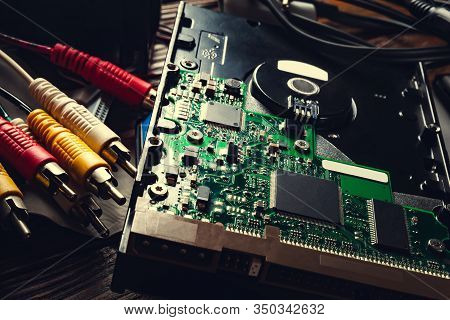 Closeup Of Computer And Wire Detail. Old Computer Hard Drive And Cables. Microchips And Pc Component