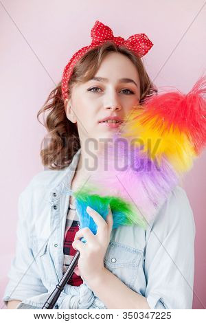 Cleaning Pin Up Woman. Smiling Pinup Girl Holds Colorful Duster Brush. Cleaning Service. Pin-up Girl