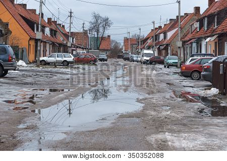 Old Single-storey Houses, Dirty Street Without A Road, Baltiysk, Kaliningrad Region, Russia, Februar