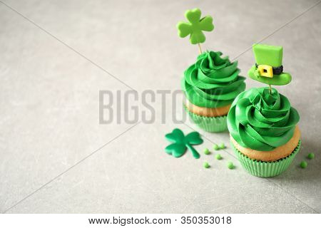 Delicious Decorated Cupcakes On Light Table, Space For Text. St. Patrick's Day Celebration